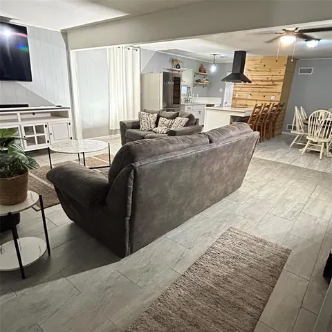 a kitchen with a sink appliances and cabinets