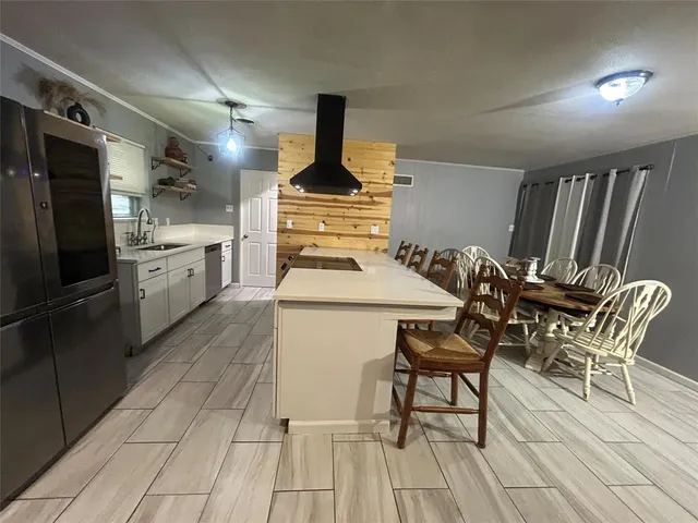 a bathroom with a sink a toilet and window