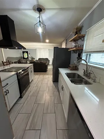 a room with gym equipment and a large mirror