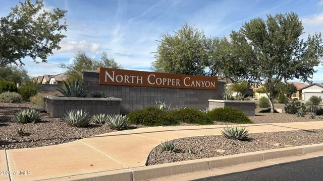 a view of street sign on a sidewalk