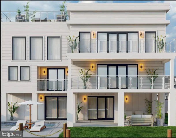 a front view of building with a garden and entryway