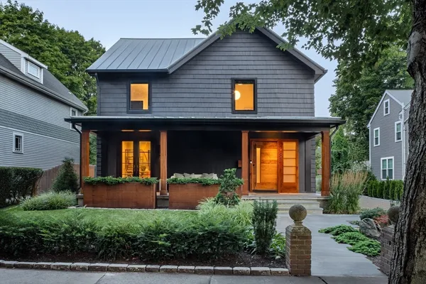 a front view of a house with garden