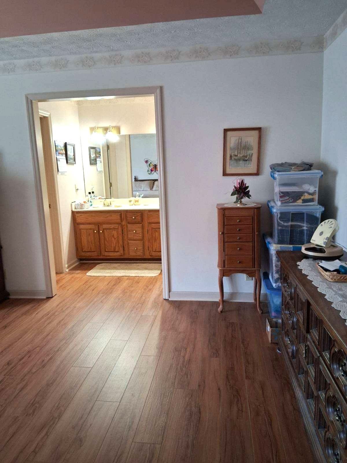 3168 Maxey Road Cedar Hill, TN 37032 - Photo 35 of 40 a view of a workspace with furniture and wooden floor