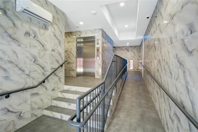 a view of a hallway with windows