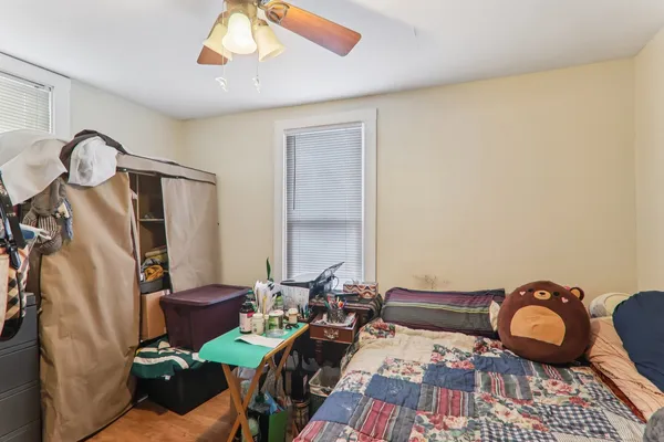 a bedroom with furniture and a window