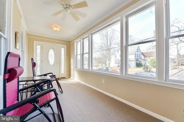 a view of a room with furniture and windows