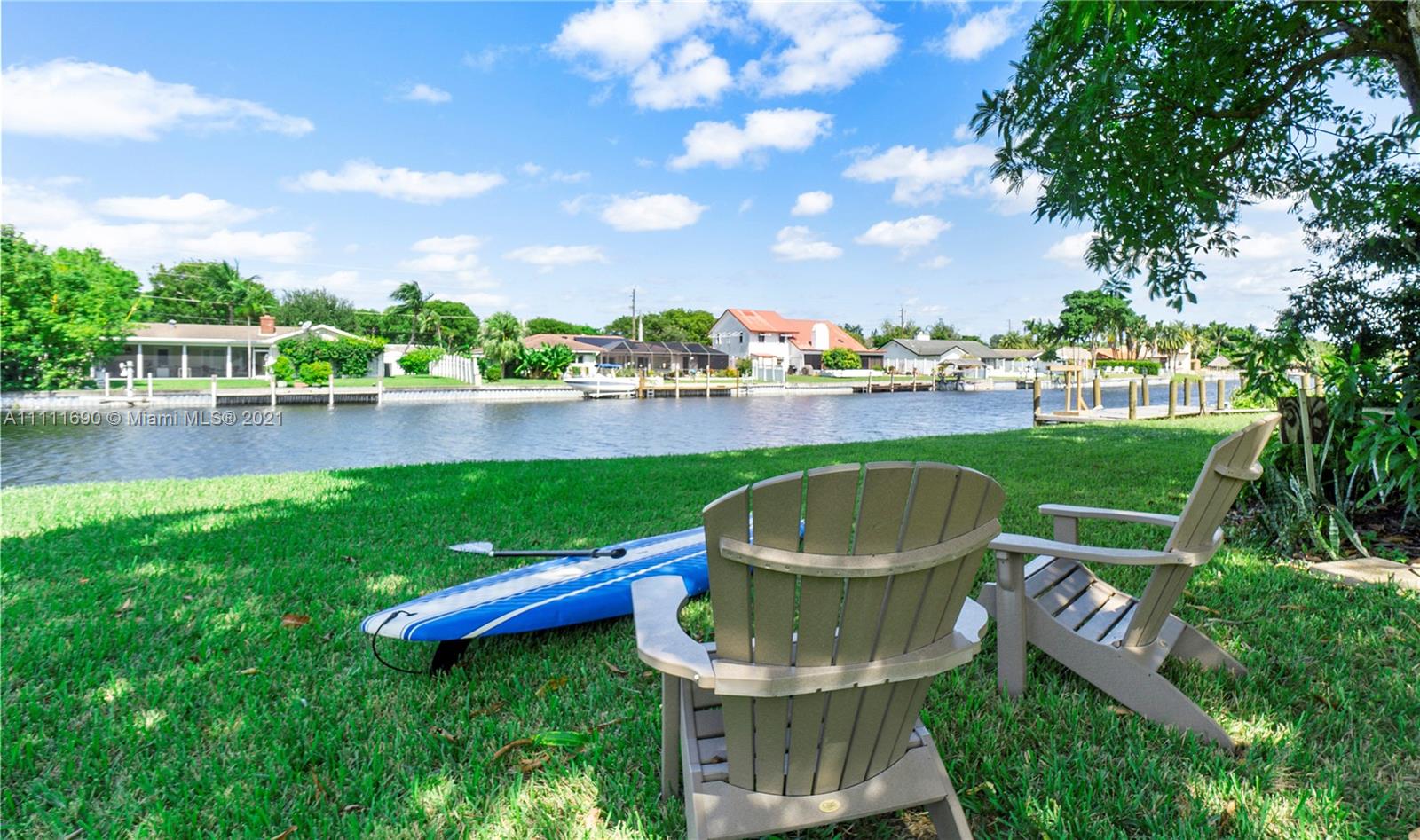 183 Oregon Lane Boca Raton, FL 33487 - Photo 1 of 25 a view of a garden with a lake