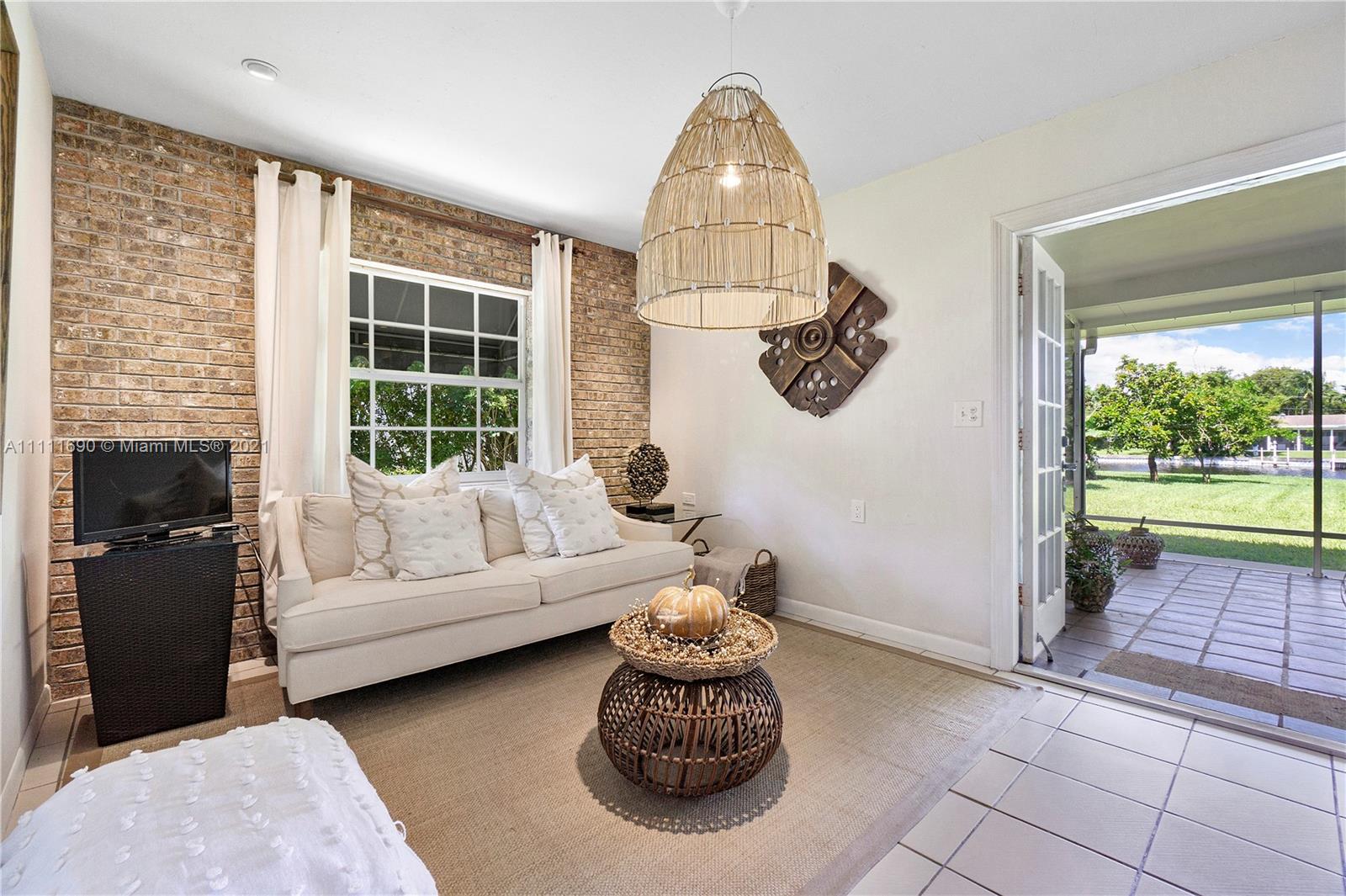 183 Oregon Lane Boca Raton, FL 33487 - Photo 12 of 25 a living room with furniture and a window