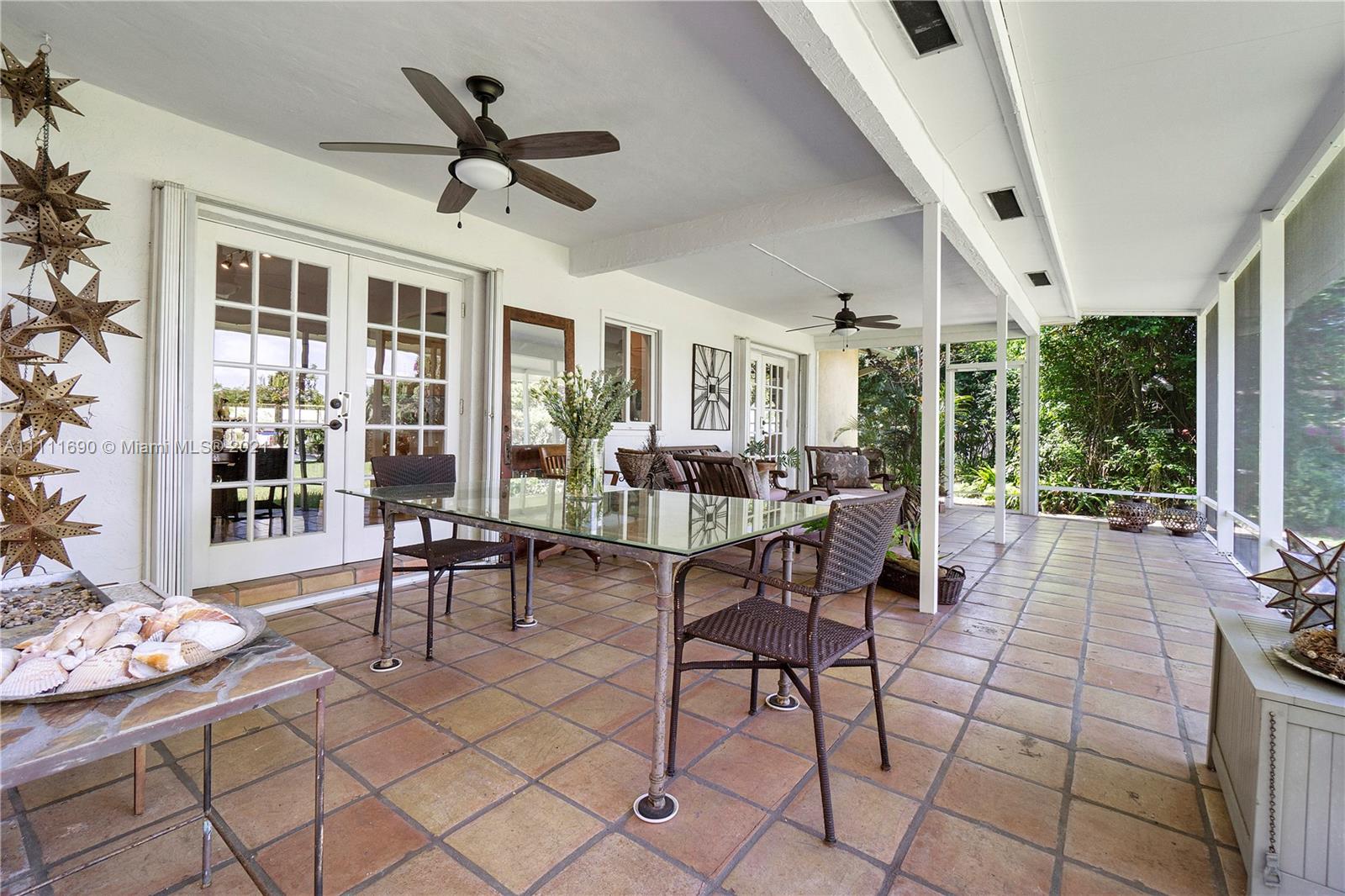 183 Oregon Lane Boca Raton, FL 33487 - Photo 14 of 25 a living room with furniture and a large window