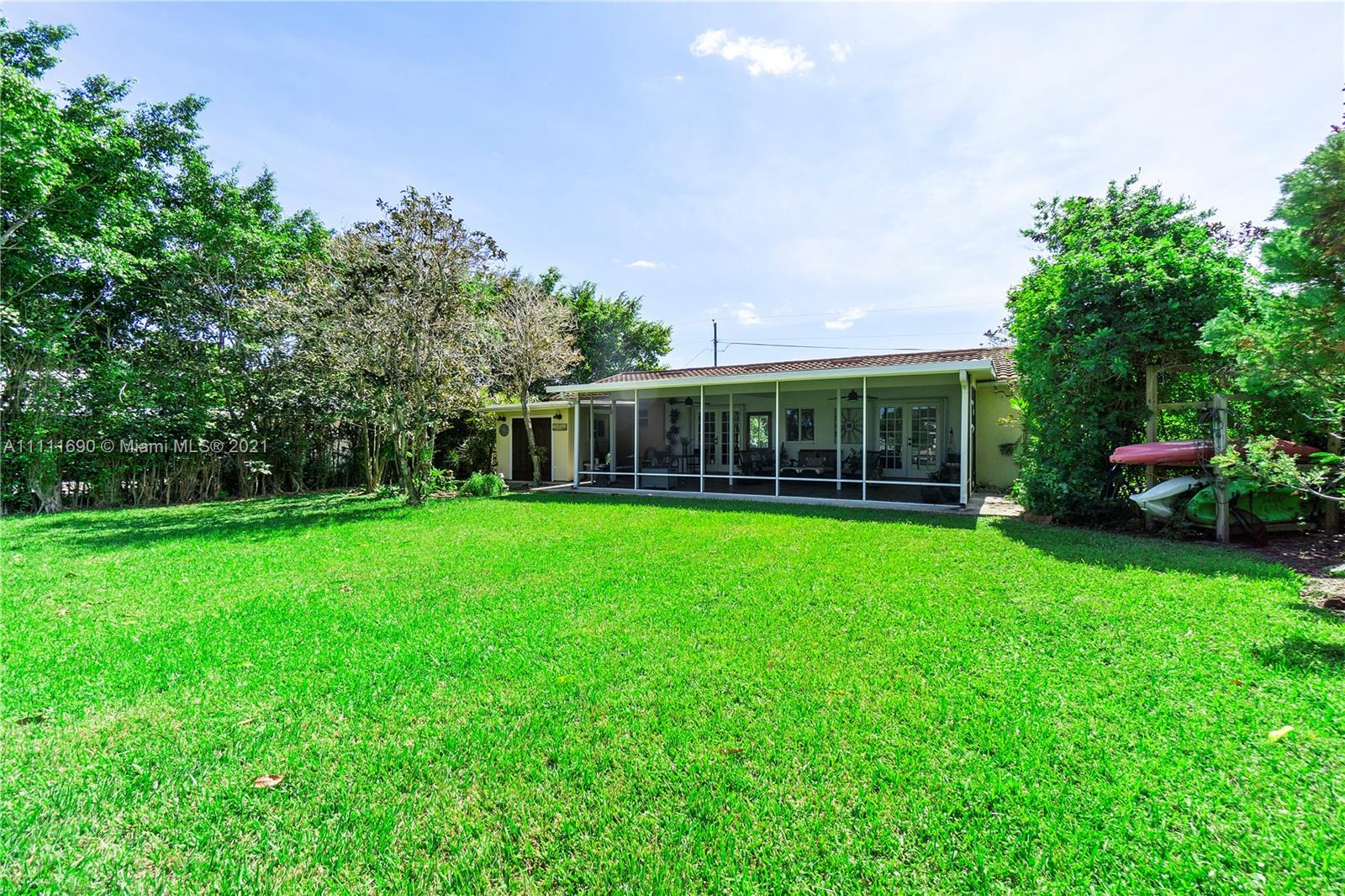 183 Oregon Lane Boca Raton, FL 33487 - Photo 15 of 25 a view of house with backyard porch and garden