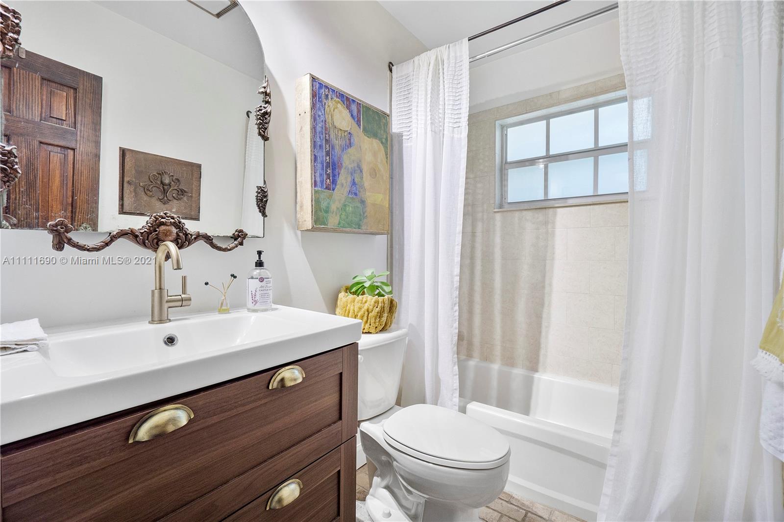 183 Oregon Lane Boca Raton, FL 33487 - Photo 20 of 25 a bathroom with a sink a toilet and shower