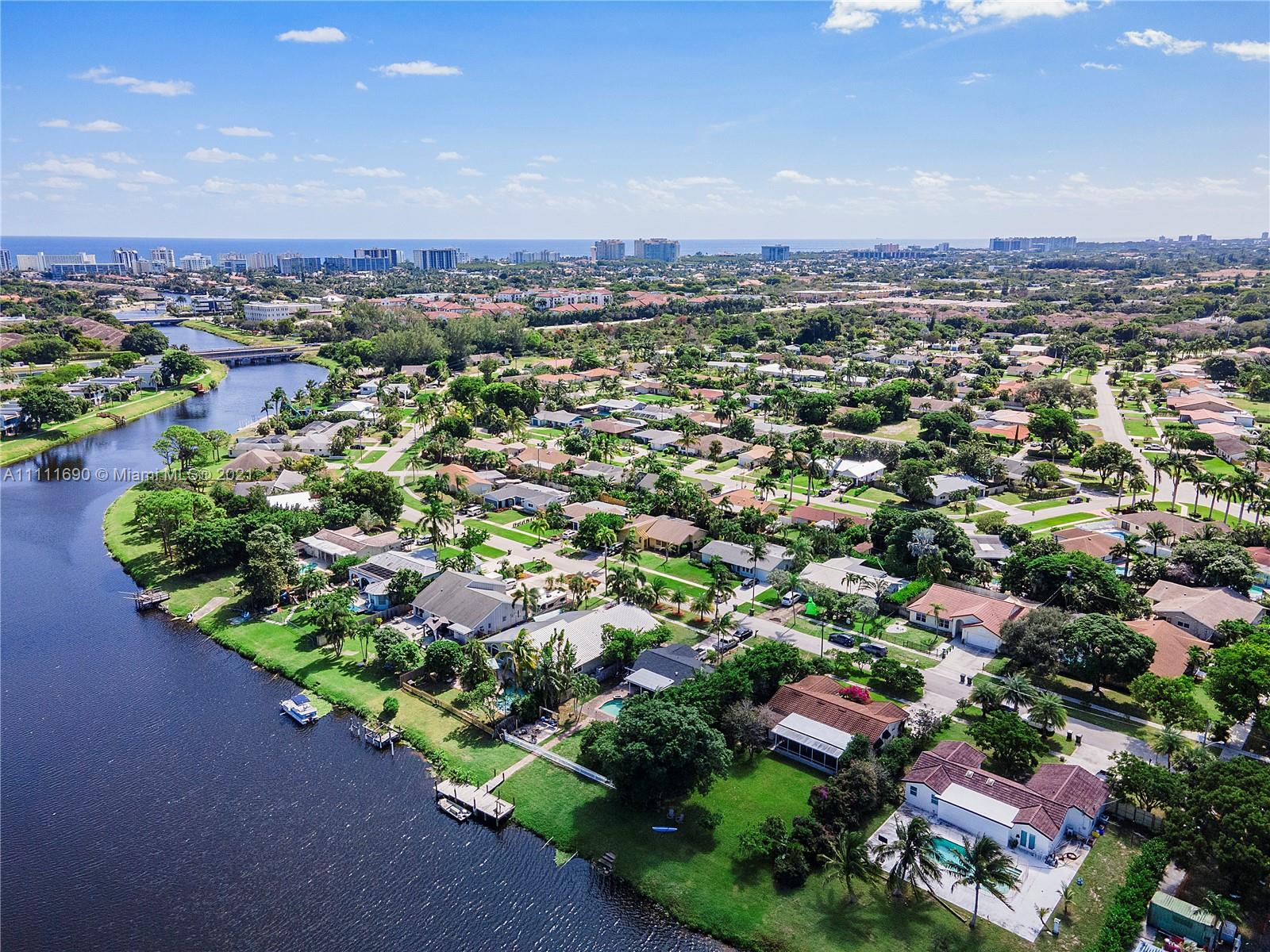183 Oregon Lane Boca Raton, FL 33487 - Photo 24 of 25 an aerial view of a city with lots of residential buildings