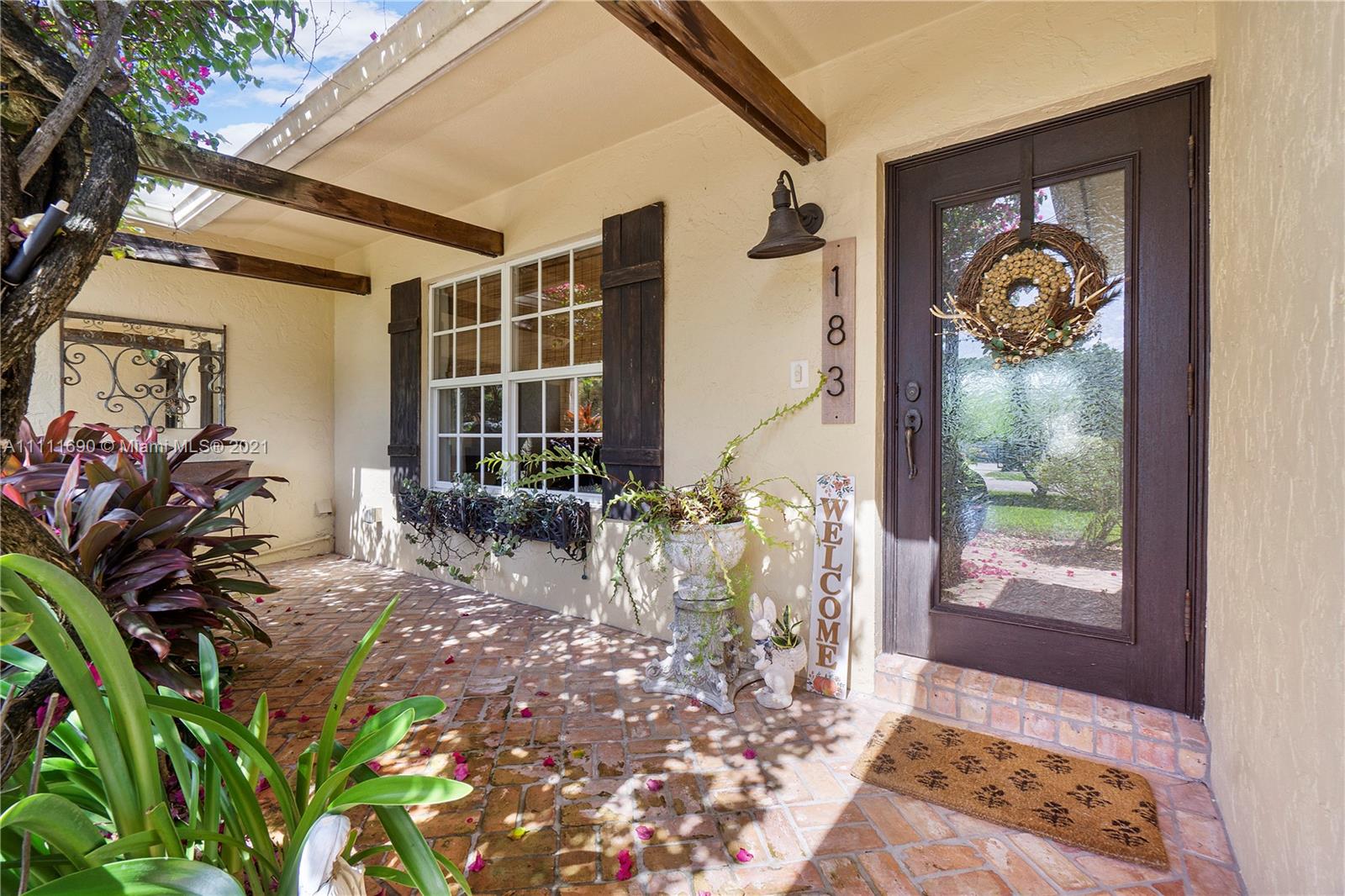 183 Oregon Lane Boca Raton, FL 33487 - Photo 5 of 25 a front view of a house with balcony