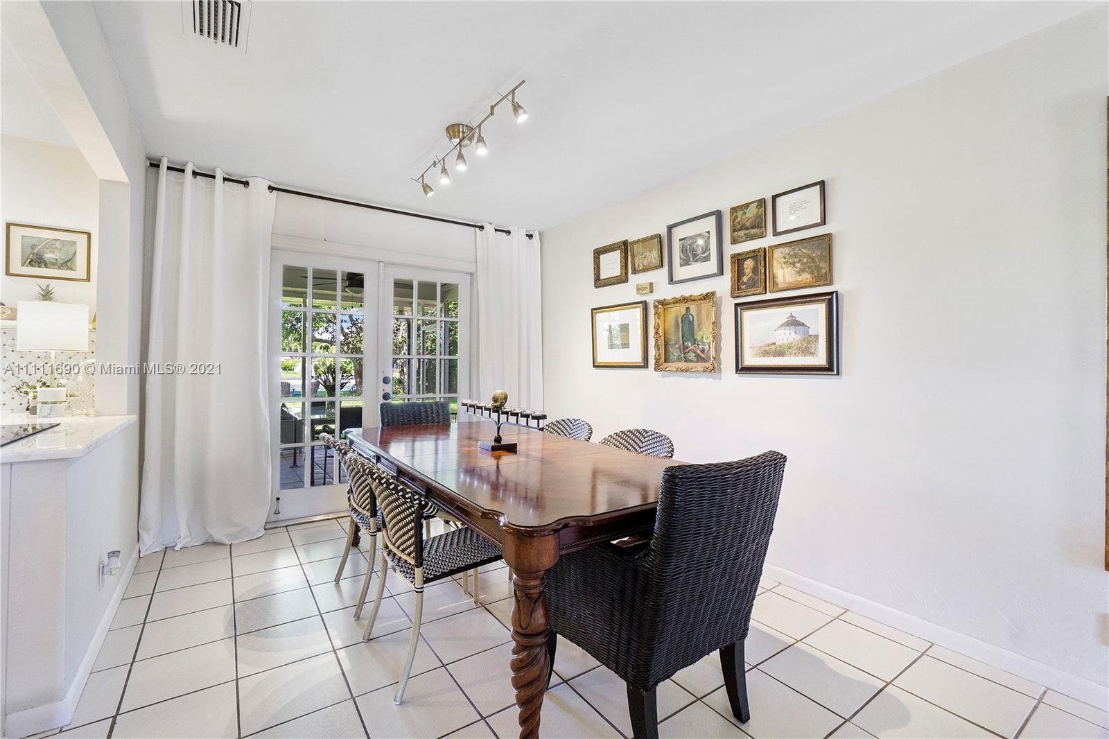 183 Oregon Lane Boca Raton, FL 33487 - Photo 8 of 25 a view of a dining room with furniture
