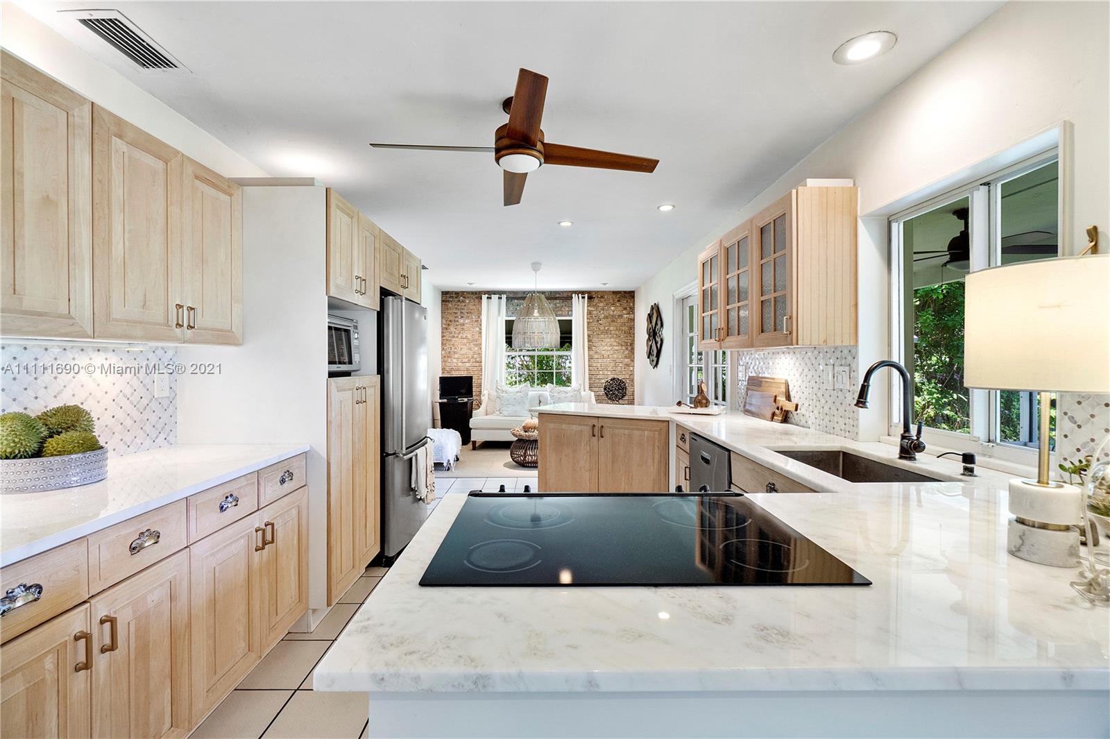 183 Oregon Lane Boca Raton, FL 33487 - Photo 9 of 25 a large kitchen with a lot of counter space