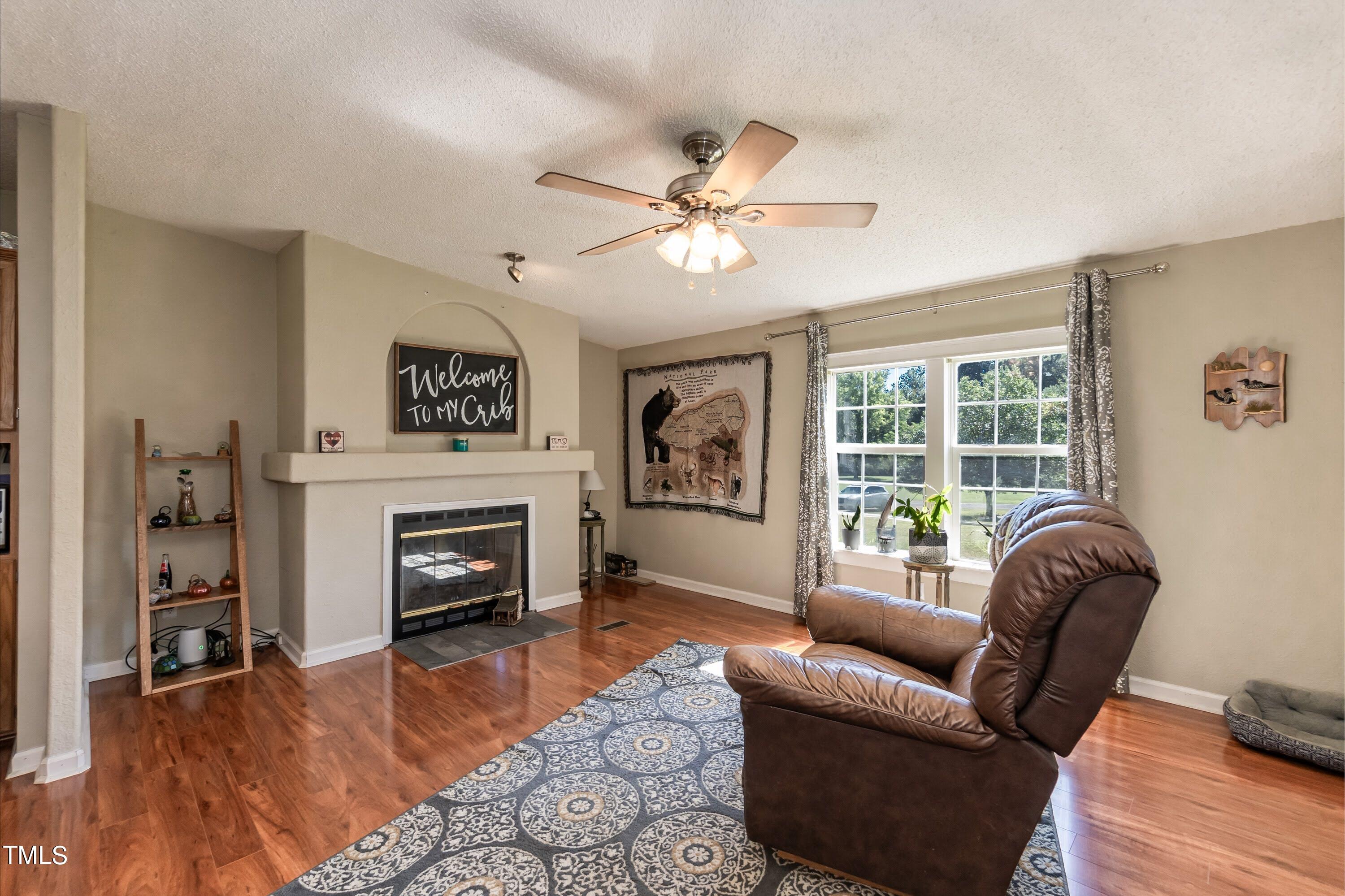 552 Locks Lane Rougemont, NC 27572 - Photo 12 of 45 a living room with furniture and a fireplace