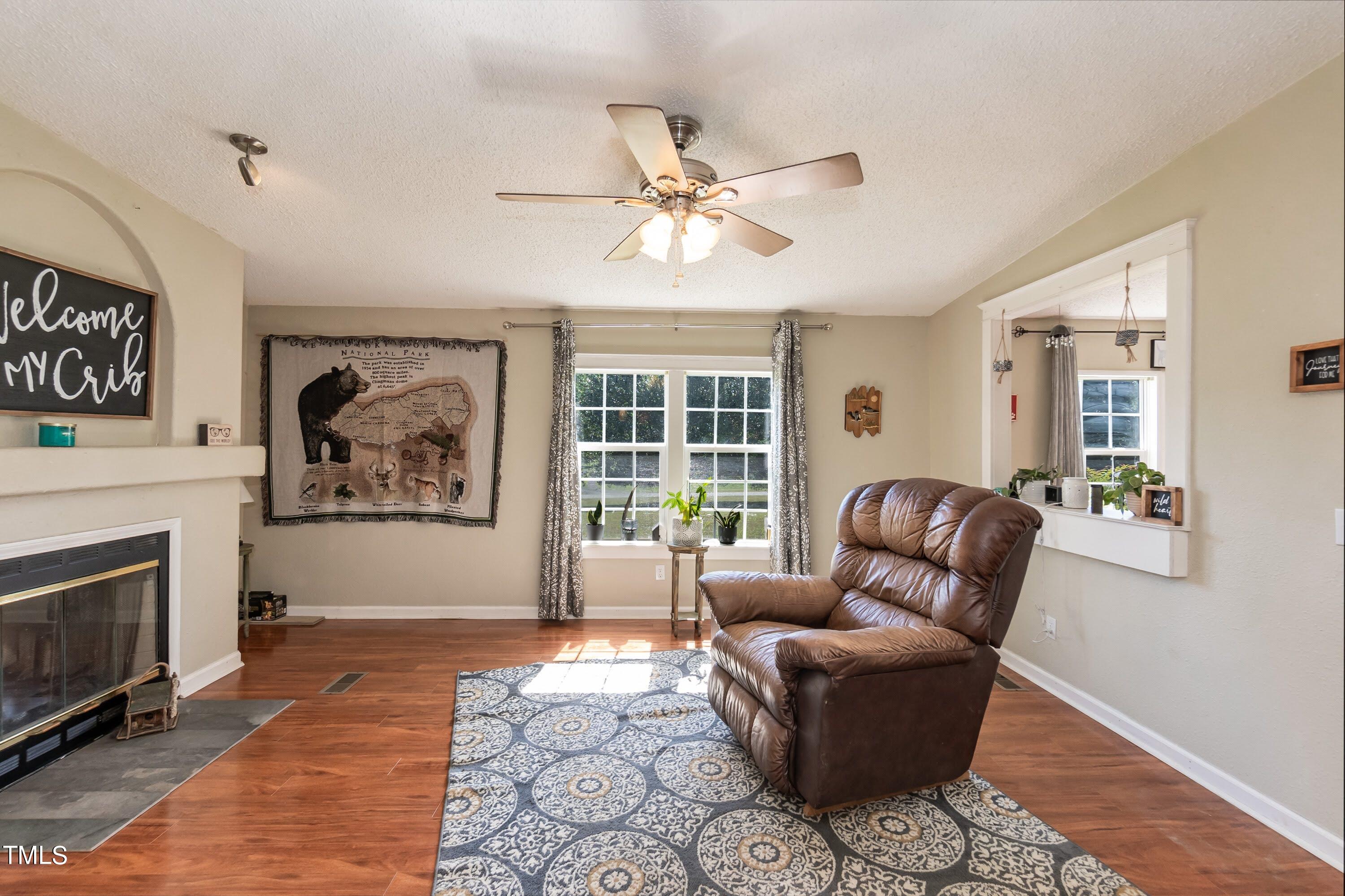 552 Locks Lane Rougemont, NC 27572 - Photo 14 of 45 a living room with furniture and a fireplace
