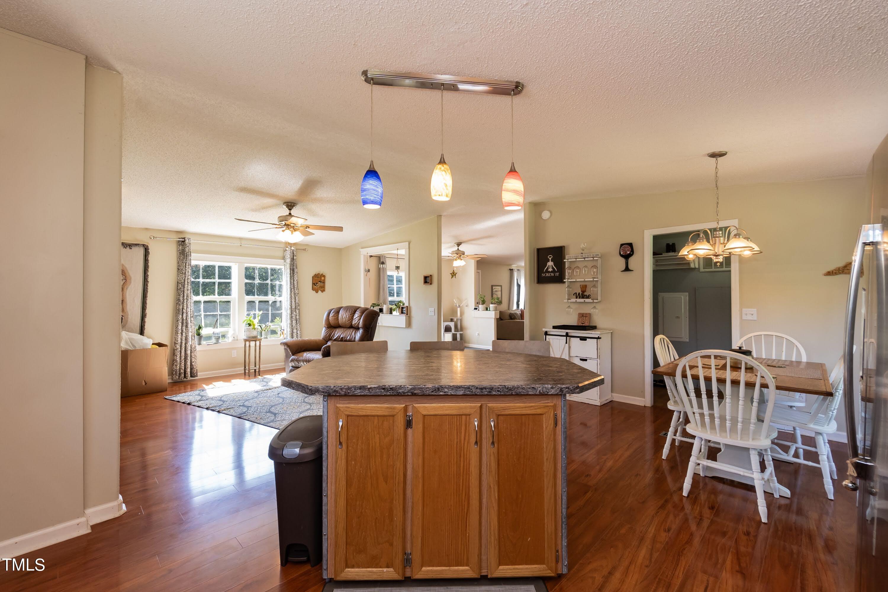 552 Locks Lane Rougemont, NC 27572 - Photo 20 of 45 a view of a dining room with furniture and wooden floor