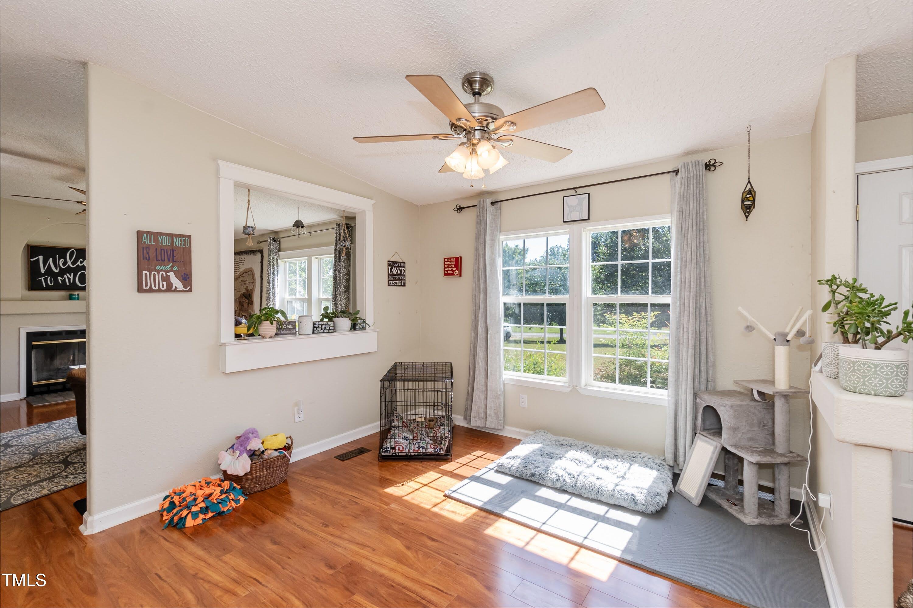 552 Locks Lane Rougemont, NC 27572 - Photo 22 of 45 a living room with a baby crib furniture and a window