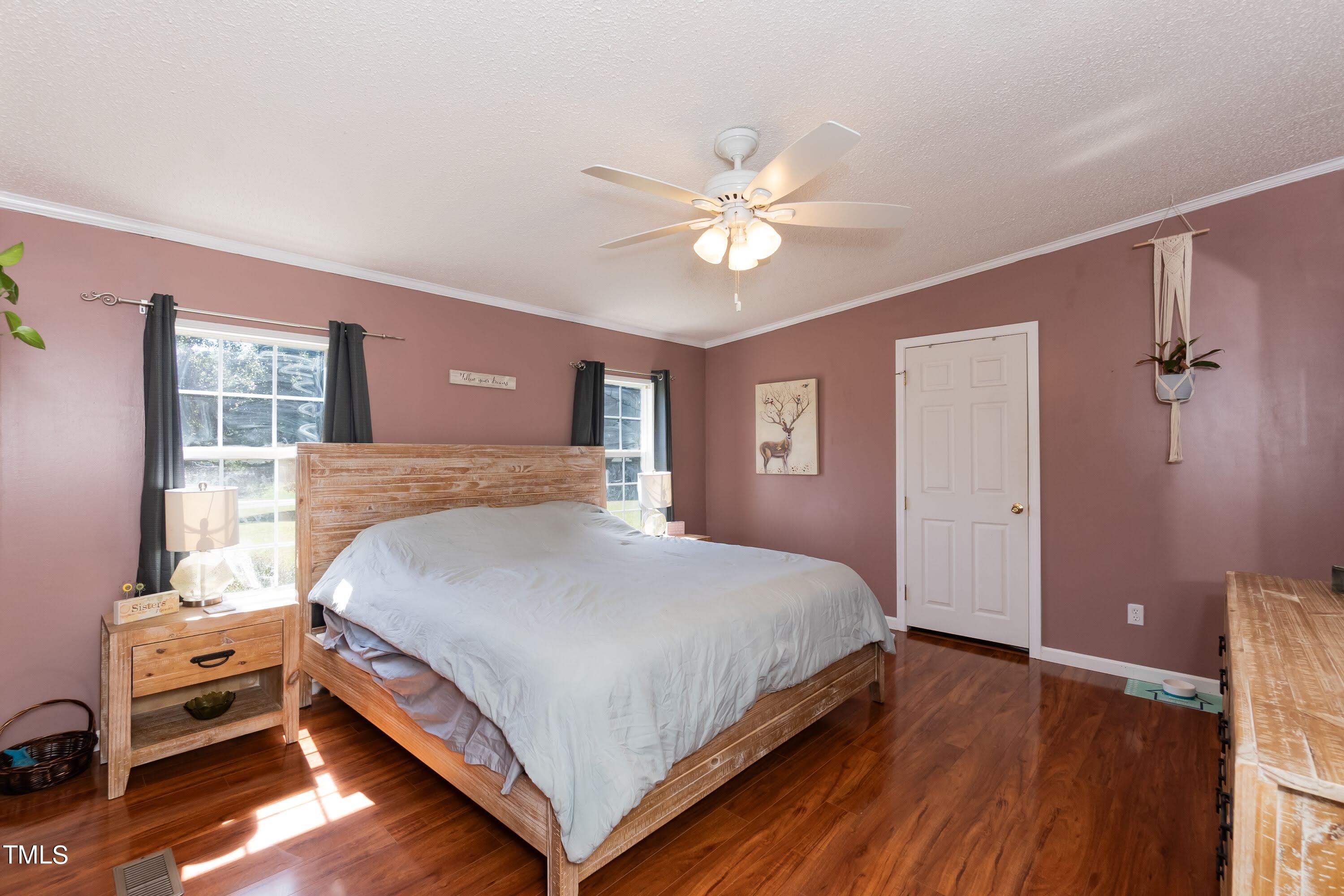 552 Locks Lane Rougemont, NC 27572 - Photo 23 of 45 a bedroom with a bed and a chandelier