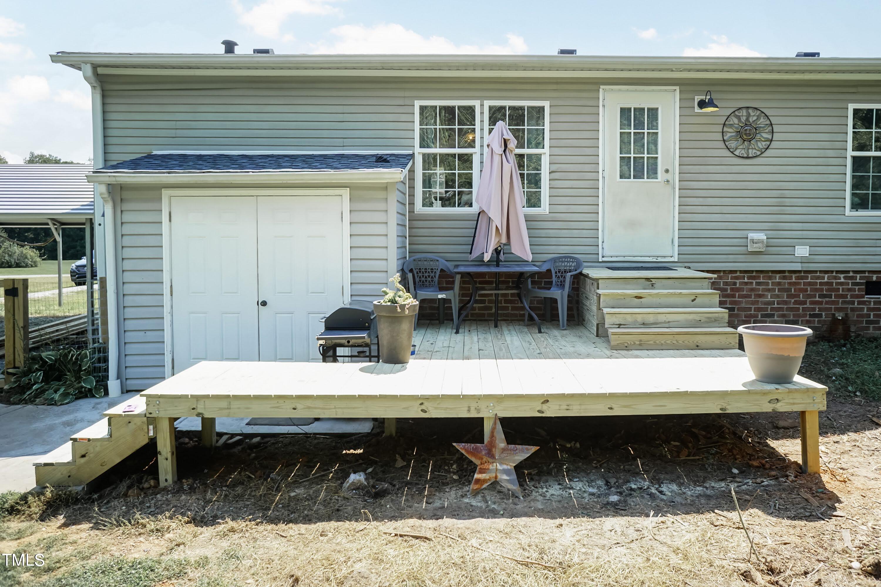 552 Locks Lane Rougemont, NC 27572 - Photo 34 of 45 a view of a chairs and table in the patio