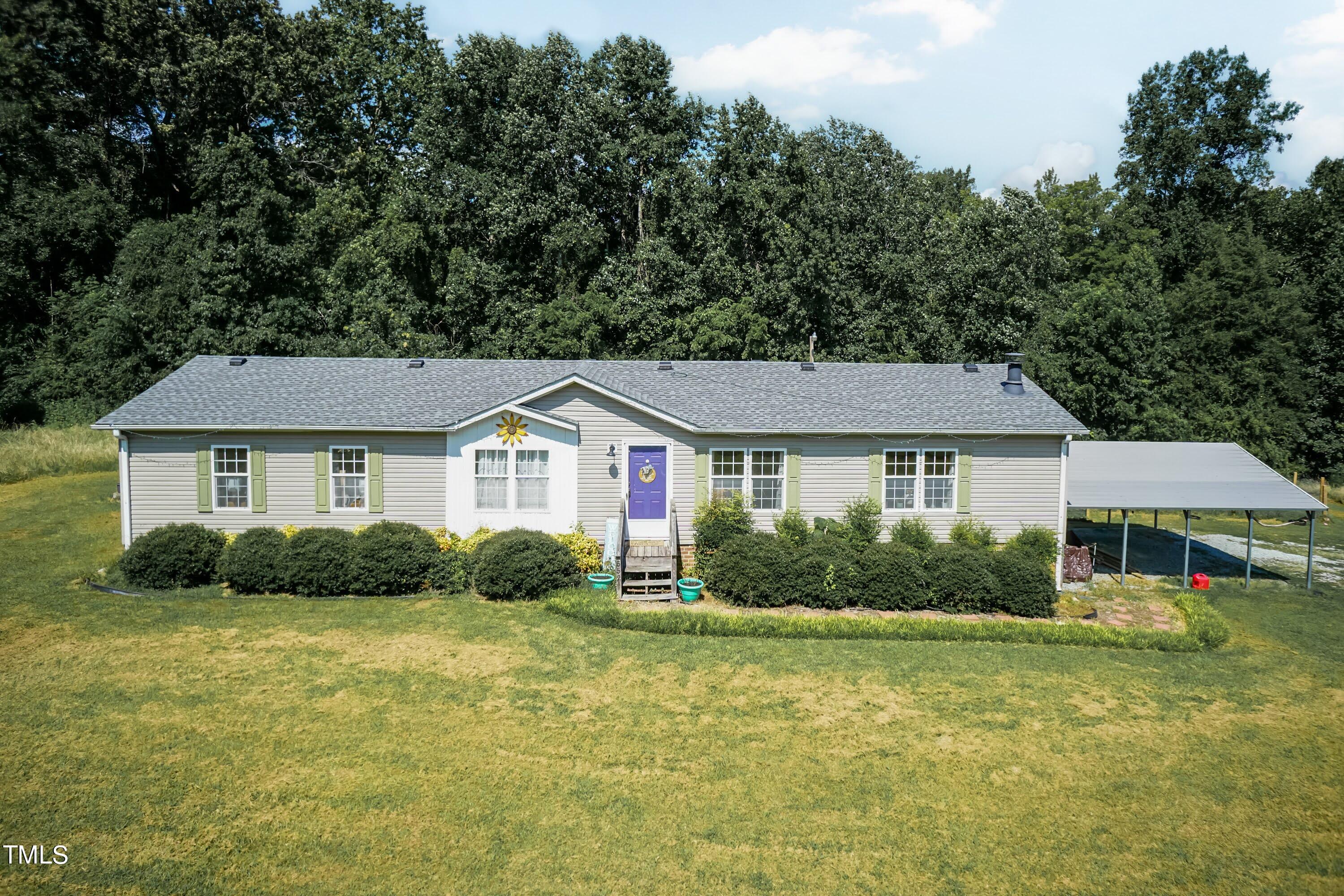 552 Locks Lane Rougemont, NC 27572 - Photo 4 of 45 a front view of a house with garden