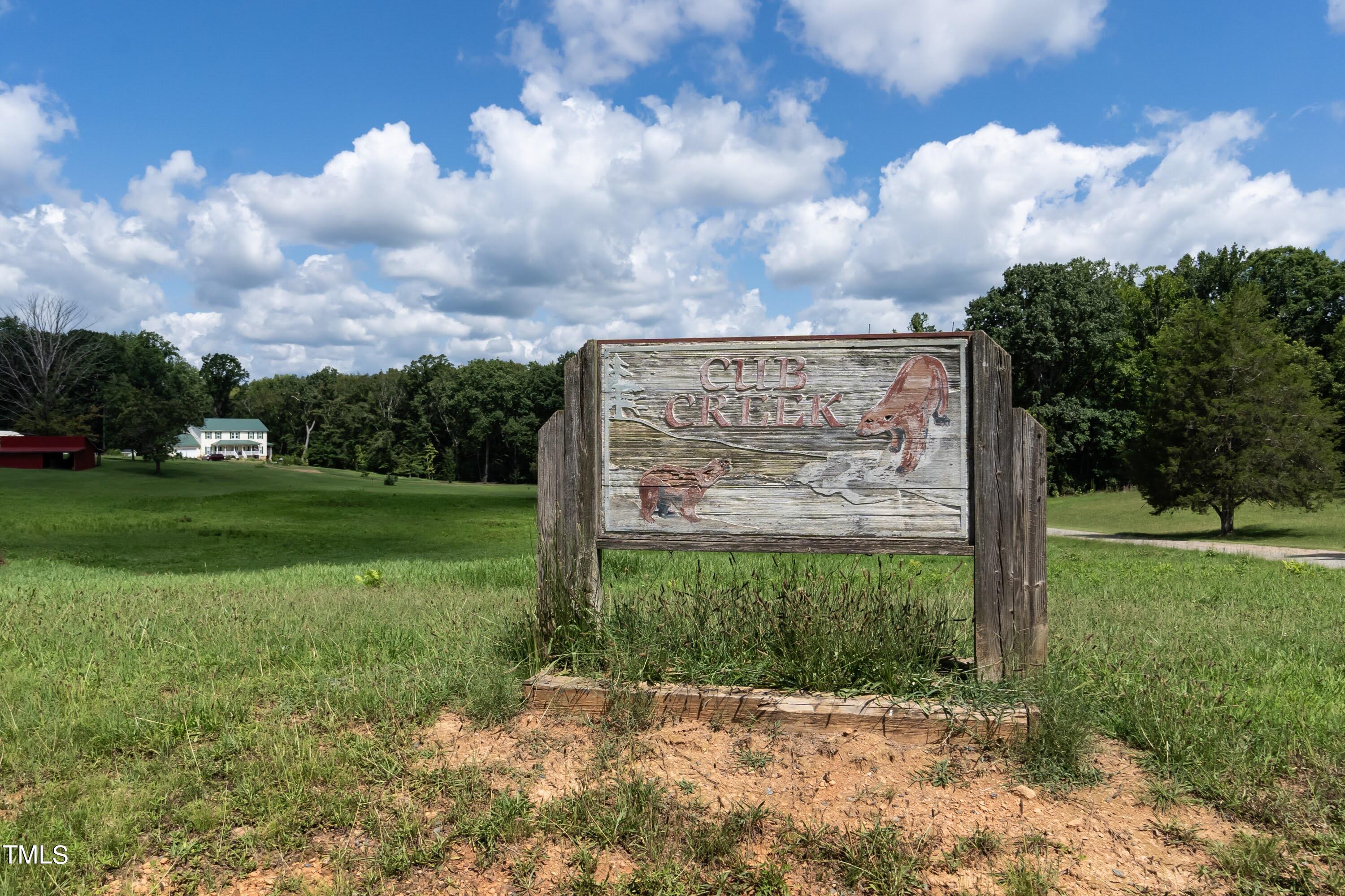552 Locks Lane Rougemont, NC 27572 - Photo 45 of 45 a view of a garden with a building in the background