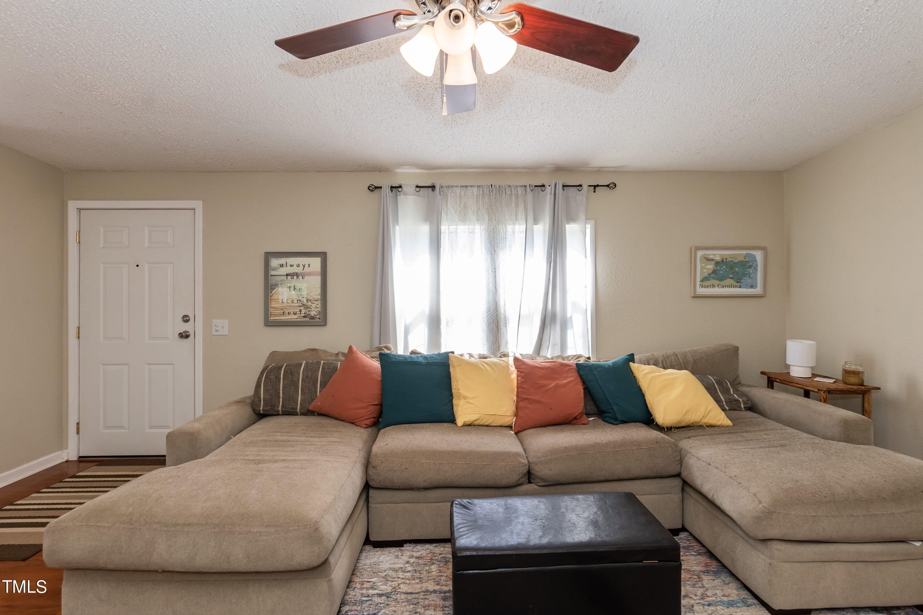 552 Locks Lane Rougemont, NC 27572 - Photo 9 of 45 a living room with furniture and a large window