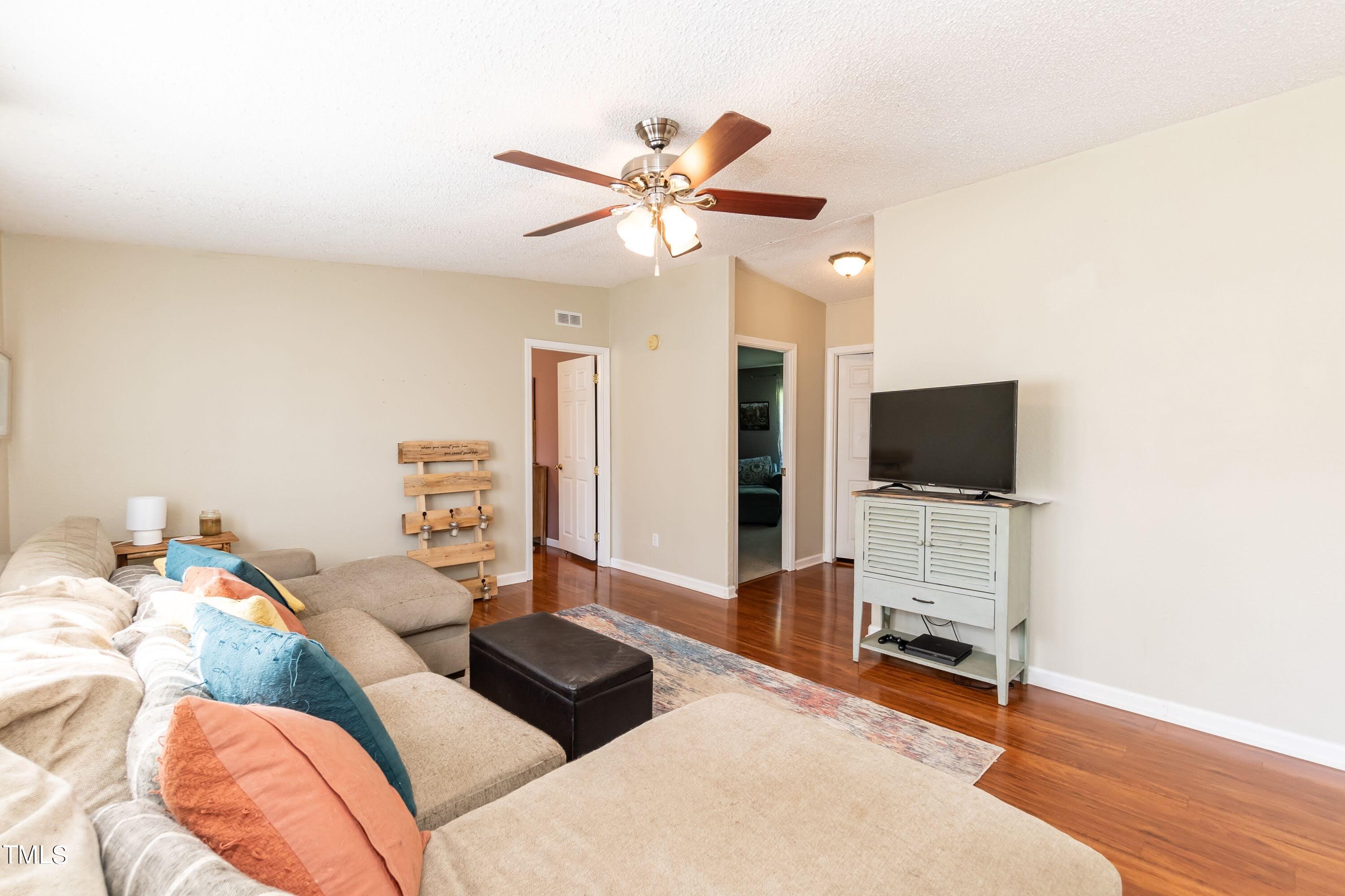 552 Locks Lane Rougemont, NC 27572 - Photo 10 of 45 a living room with furniture and a flat screen tv