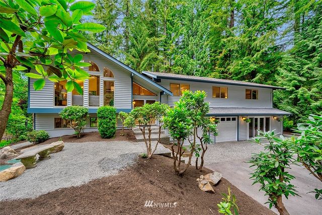 a house with a tree in front of it