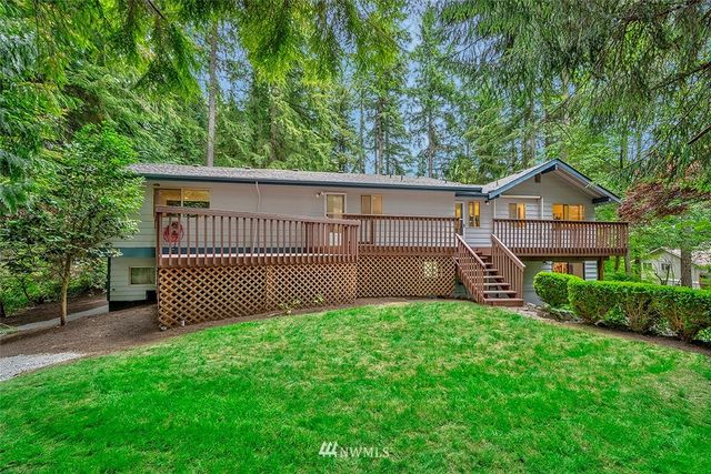 a view of a backyard with a small cabin