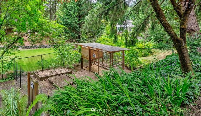 a view of a backyard with sitting area