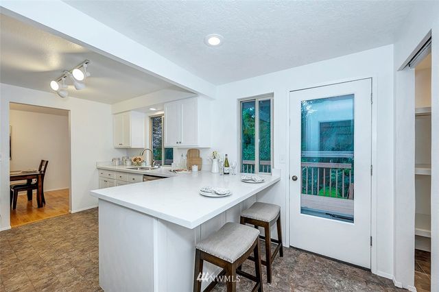a view of kitchen with breakfast area