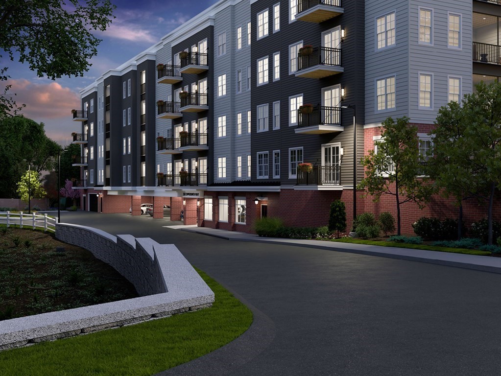 a view of a building with a yard