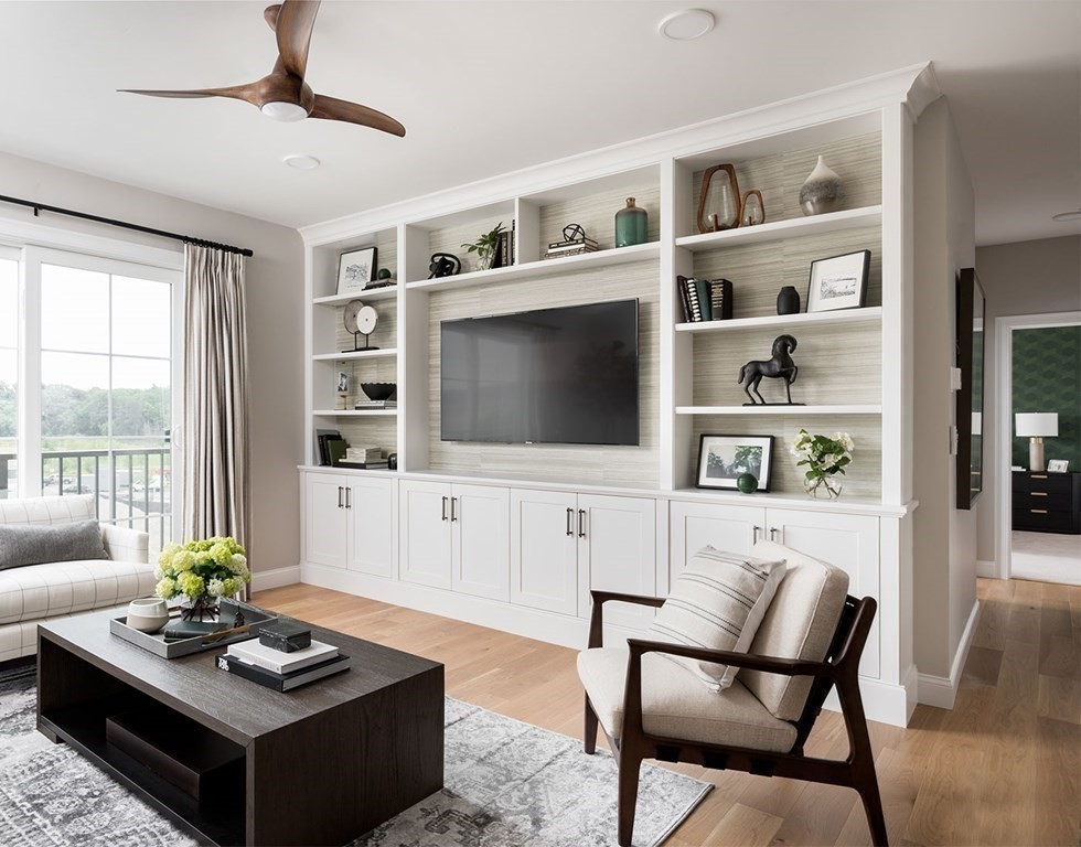50 Coppersmith Way, Unit 107 Canton, MA 02021 - Photo 19 of 42 a living room with furniture and a flat screen tv