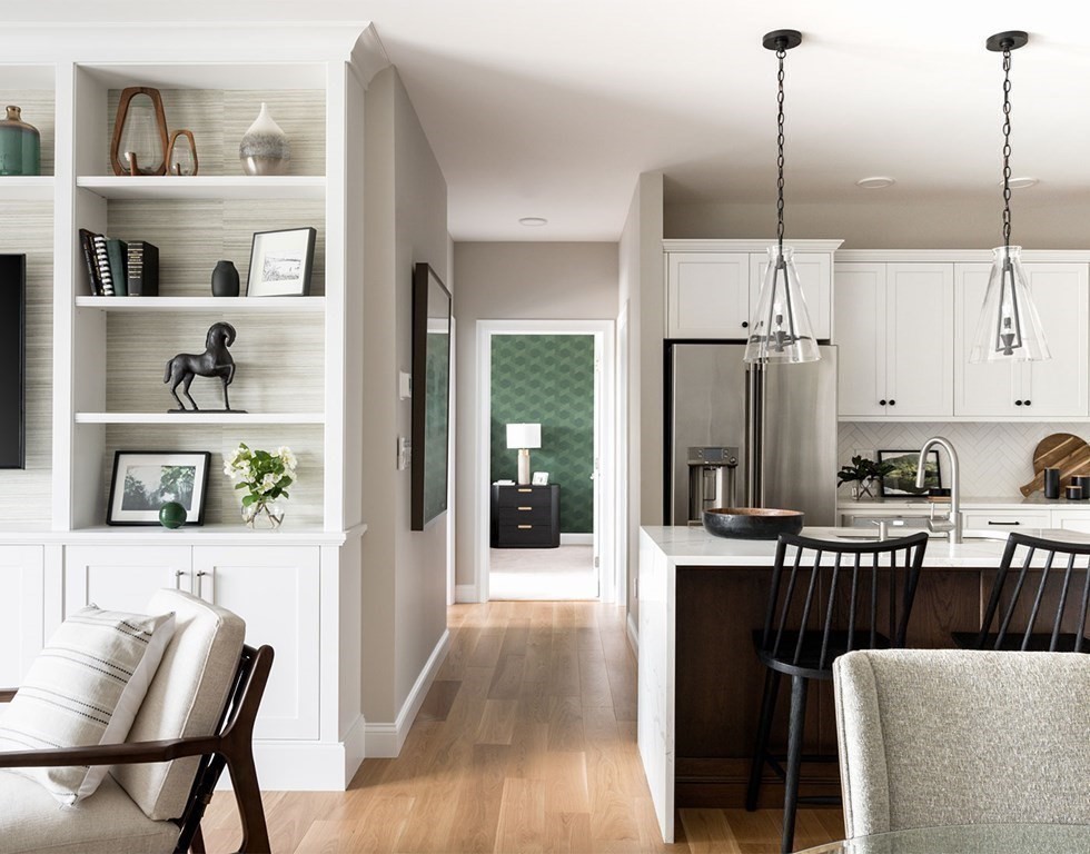 50 Coppersmith Way, Unit 107 Canton, MA 02021 - Photo 20 of 42 a view of a kitchen with furniture and wooden floor