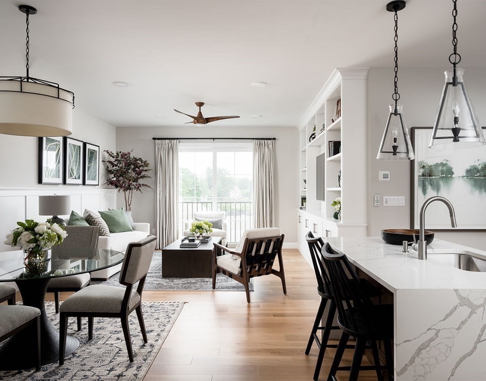 50 Coppersmith Way, Unit 107 Canton, MA 02021 - Photo 2 of 42 a view of a a dining room with furniture window and wooden floor