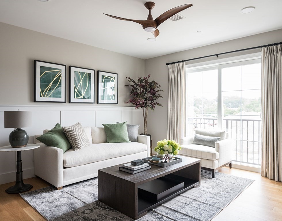 50 Coppersmith Way, Unit 107 Canton, MA 02021 - Photo 21 of 42 a living room with furniture and a large window