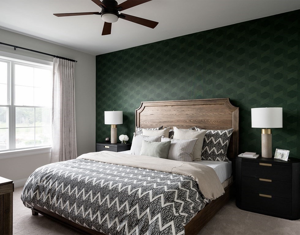 50 Coppersmith Way, Unit 107 Canton, MA 02021 - Photo 24 of 42 a bedroom with a bed and a lamp