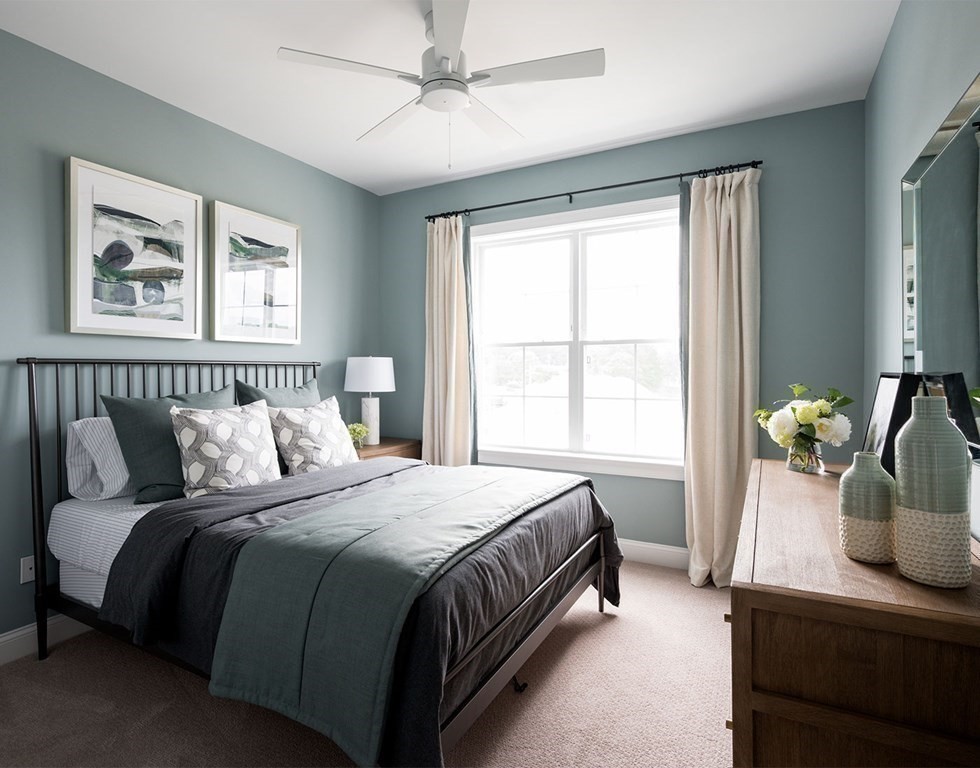 50 Coppersmith Way, Unit 107 Canton, MA 02021 - Photo 26 of 42 a bedroom with a bed and window