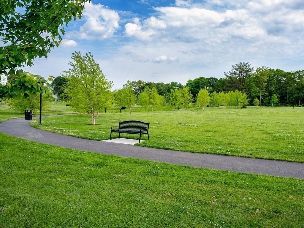50 Coppersmith Way, Unit 107 Canton, MA 02021 - Photo 32 of 42 a view of a park and trees in the background
