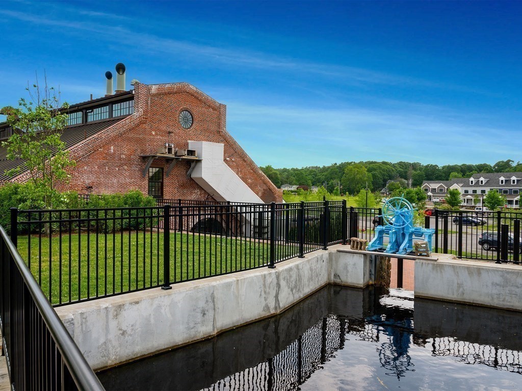 50 Coppersmith Way, Unit 107 Canton, MA 02021 - Photo 35 of 42 a view of a balcony with a garden