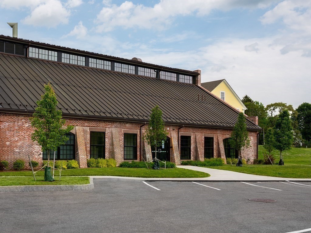 50 Coppersmith Way, Unit 107 Canton, MA 02021 - Photo 36 of 42 a view of brick house with a big yard plants and large trees