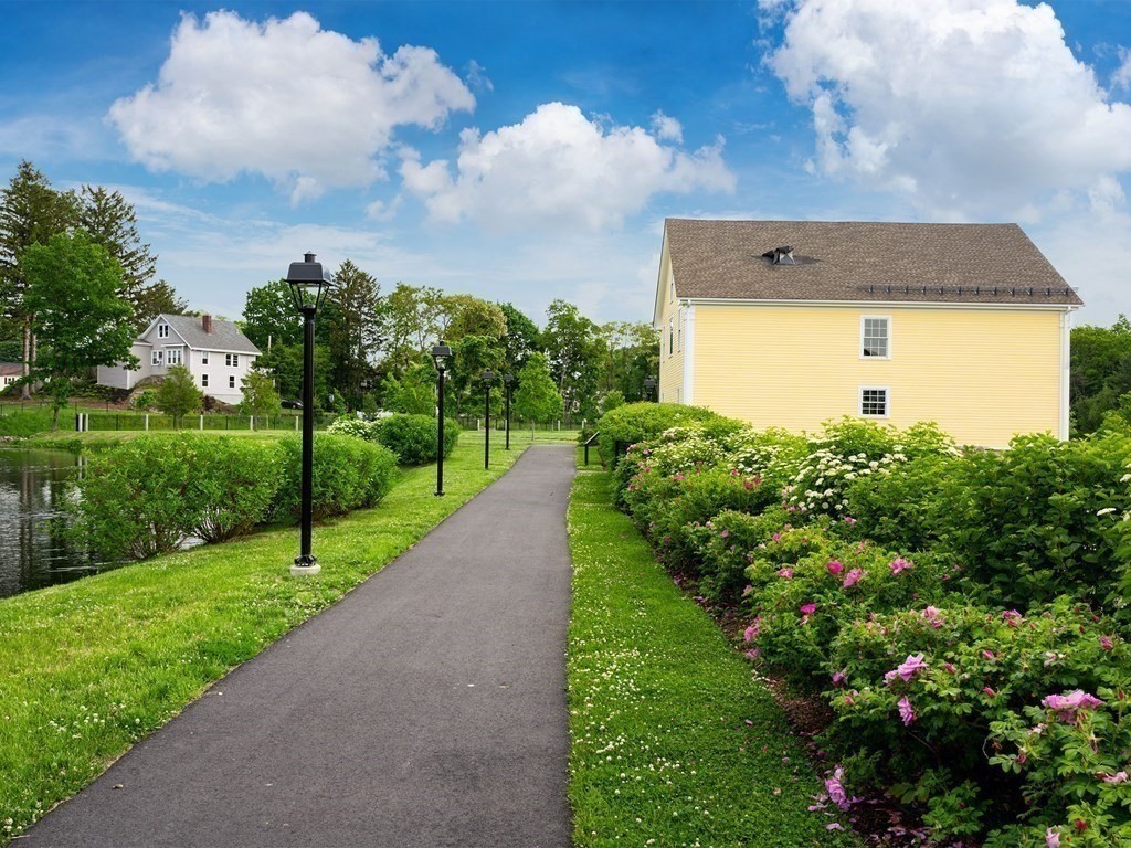 50 Coppersmith Way, Unit 107 Canton, MA 02021 - Photo 38 of 42 a view of a back yard