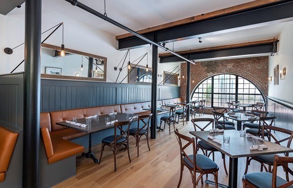 50 Coppersmith Way, Unit 107 Canton, MA 02021 - Photo 40 of 42 a view of a dining room with furniture window and wooden floor