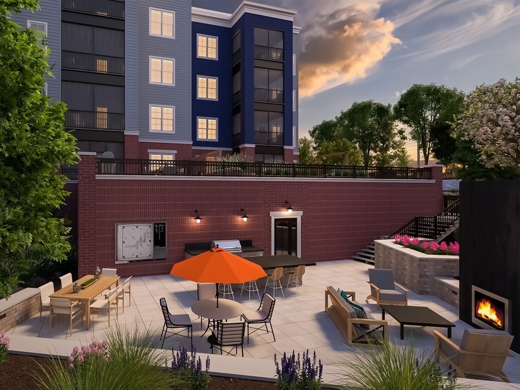 50 Coppersmith Way, Unit 107 Canton, MA 02021 - Photo 4 of 42 a backyard of a house with outdoor seating