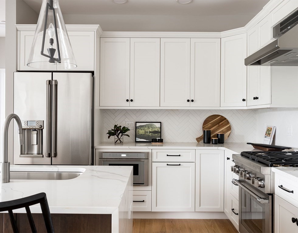50 Coppersmith Way, Unit 107 Canton, MA 02021 - Photo 8 of 42 a kitchen with white cabinets and white appliances