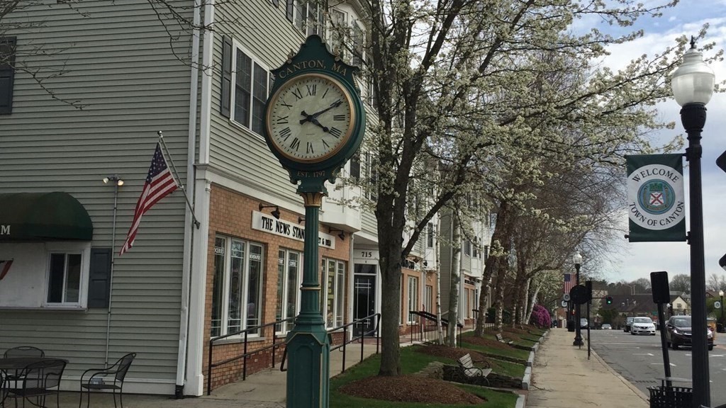 50 Coppersmith Way, Unit 107 Canton, MA 02021 - Photo 10 of 42 a clock on a wall in front of building