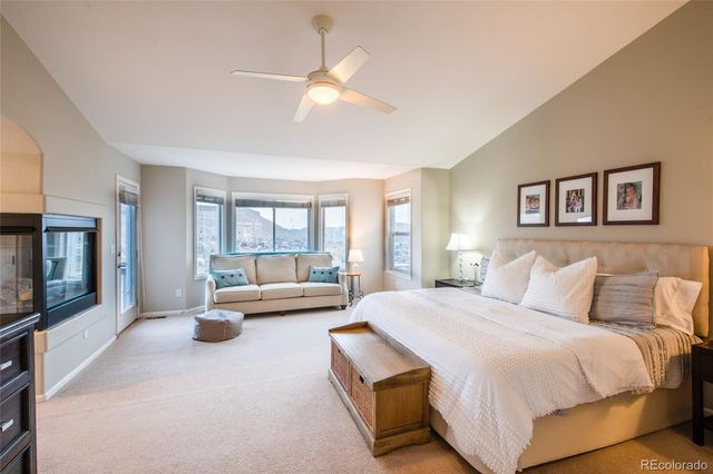 a bedroom with a bed and a television