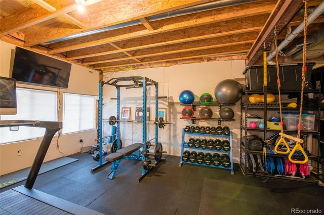 a view of a balcony with wooden floor and city view